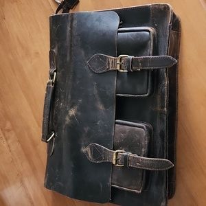 Leather briefcase with laptop storage.
